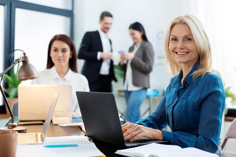 A person sitting at a desk with a computer
AI-generated content may be incorrect.